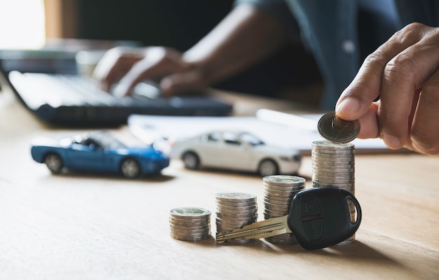 Car insurance and car service with stack of coins. 