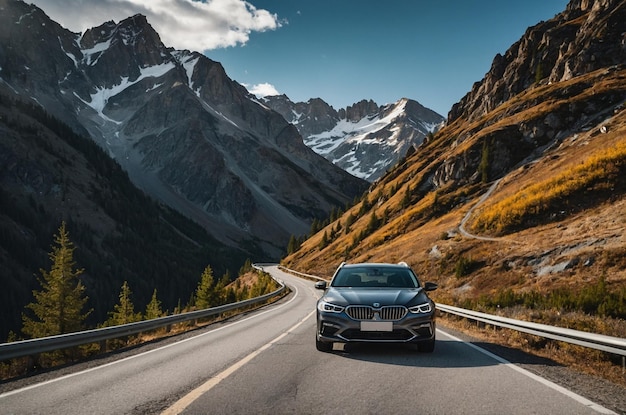 a car is driving down a road with mountains in the background