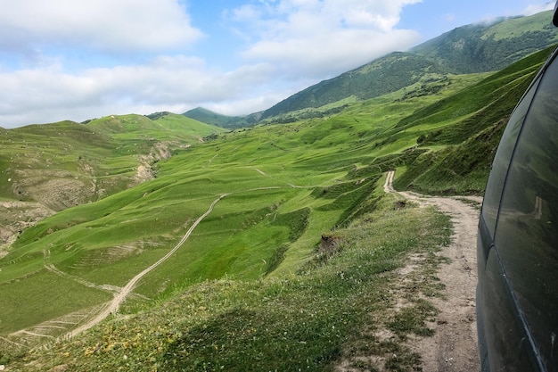 The car is in the gorge of the Cherek River in the vicinity of the Gymyhli tract Caucasus June 2021