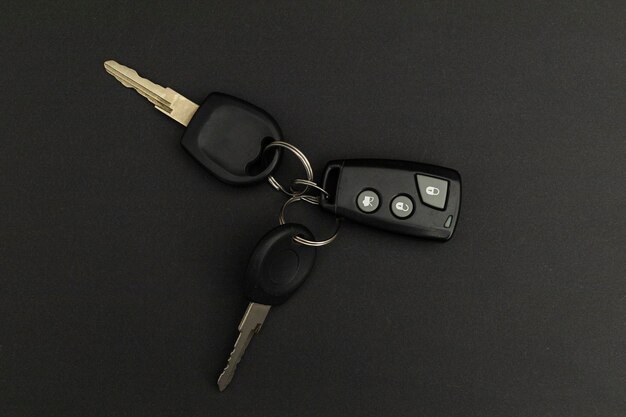 Car keys on black background