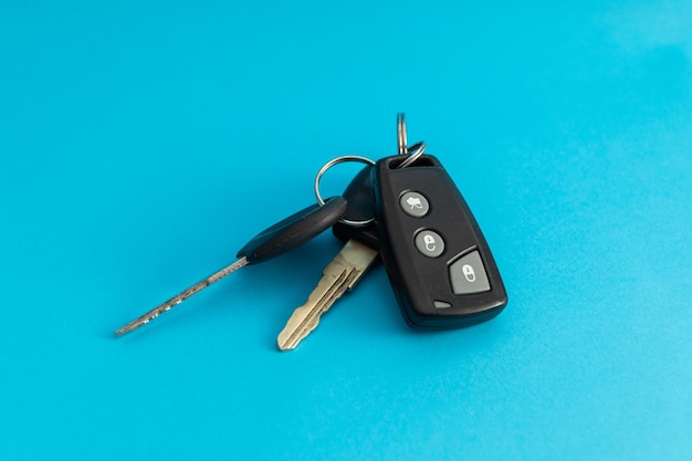 Car keys on blue background