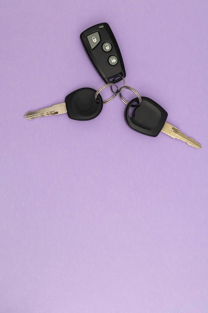 Car keys on purple background