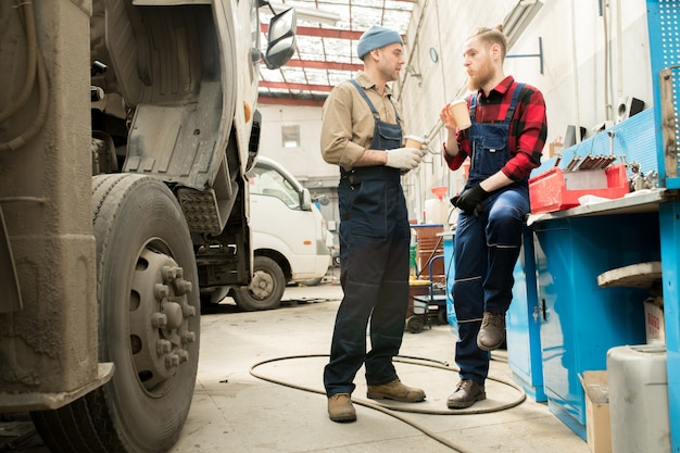 Car Mechanics On Coffee Break