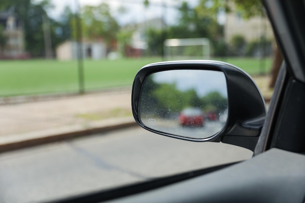 A car mirror reflects the journey ahead symbolizing selfreflection perspective awareness and th