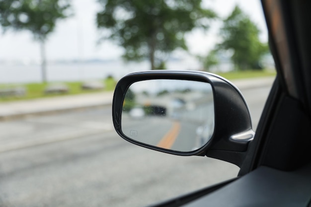 A car mirror reflects the journey ahead symbolizing selfreflection perspective awareness and th