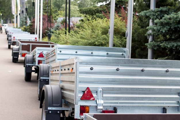 Car open trailers in the parking lot Sales store for atomobiles