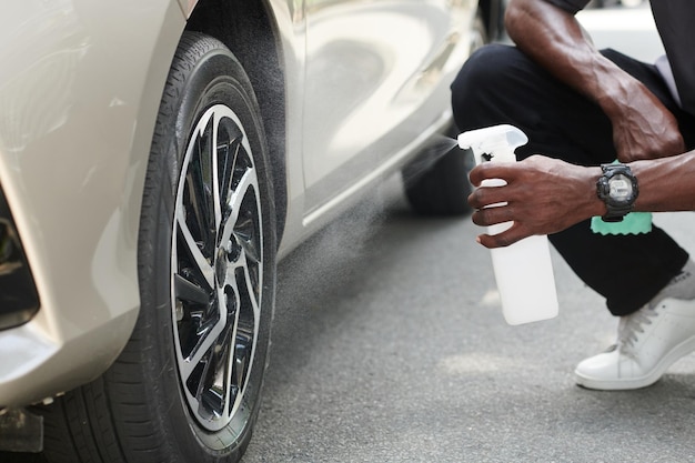 Car Owner Using Anti Dust Spray