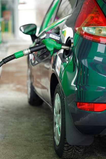 Car refueling on a petrol station in winter