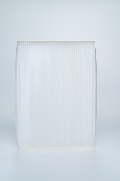 The car's air filter against a white background. Car parts store. Car repairs and maintenance. 