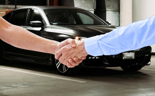 car selling deal, hand shake gesture on sold car