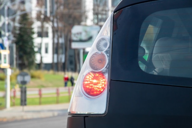 Car taillight on the road close up