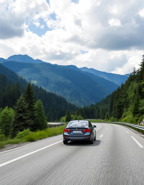 a car that is on the road with mountains in the background