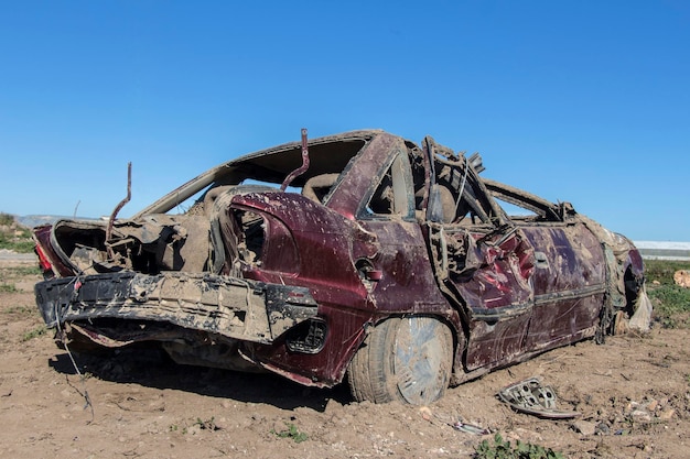 Car that was destroyed in a pole after the hurricane shattered car which struck a natural disaster