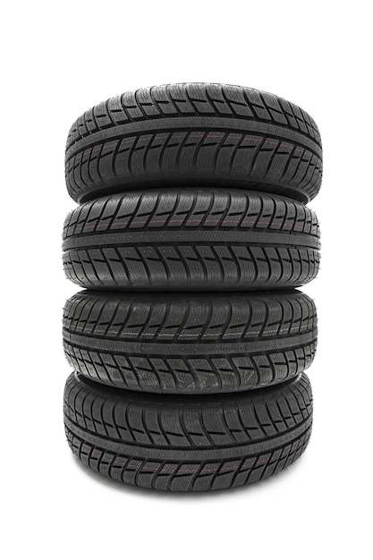 Car tires mature stack close-up Winter wheel profile structure on white background