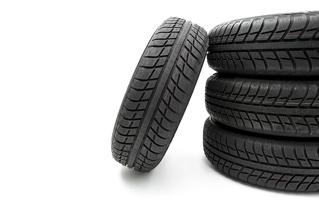 Car tires mature stack closeup Winter wheel profile structure on white background