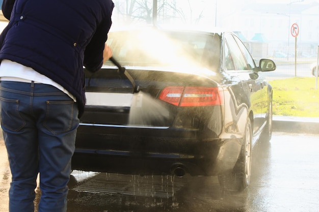 Car washing cleaning with foam and hi pressured water