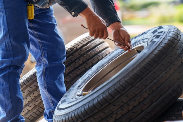 Car wheel repair outdoor without tire on the road Automotive garage for replace spare parts after fa