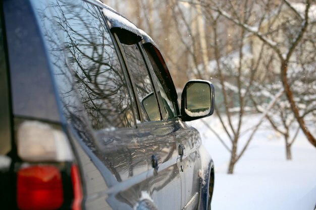 Car in winter. snowfall outside the city