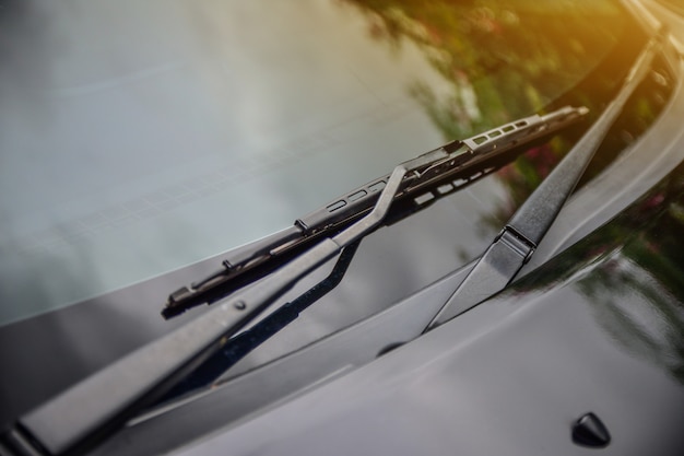 Car wiper of car parked on street sunlight background