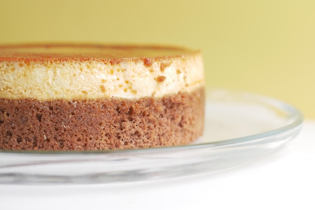 Caramel custard pudding on a plate on table