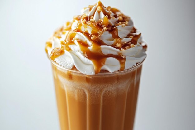 Caramel Frappuccino in a clear glass with whipped cream and caramel sauce