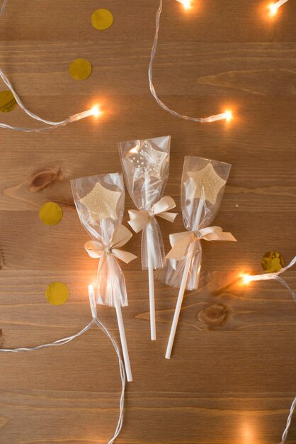 Caramel lollipops in the shape of a star on a wooden table