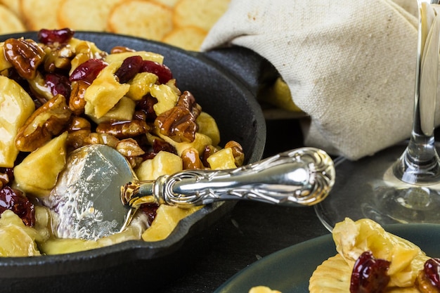 Caramel nut and cranberry brie appetizer for Christmas party.