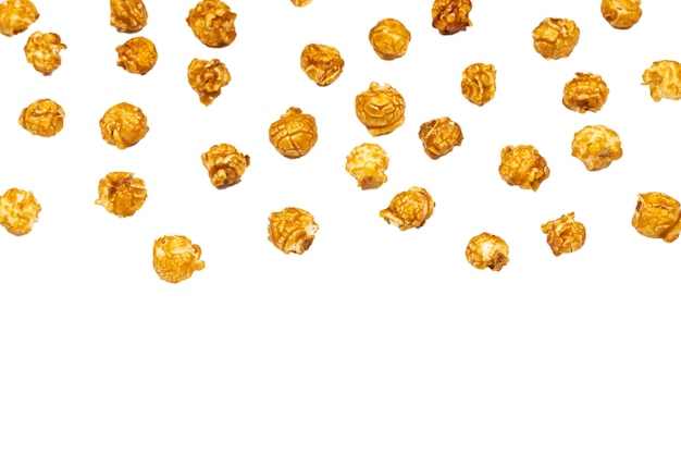 Caramel pop corn isolated on white background. Copy space.