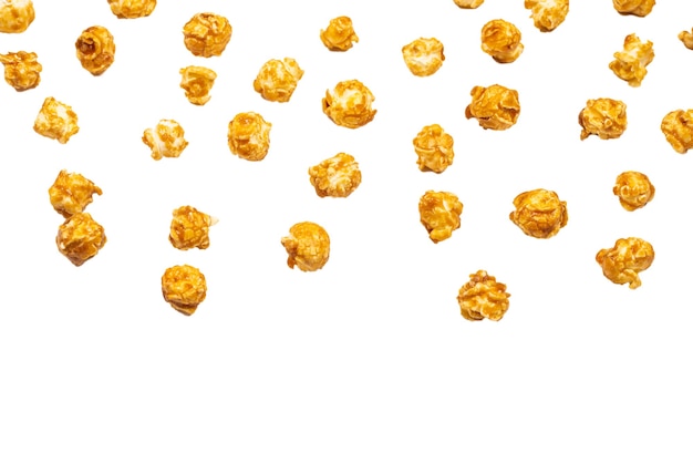 Caramel pop corn isolated on white surface. Copy space.