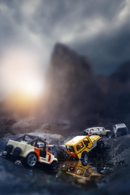 Caravan of 4x4 off road cars crossing through the mountain road