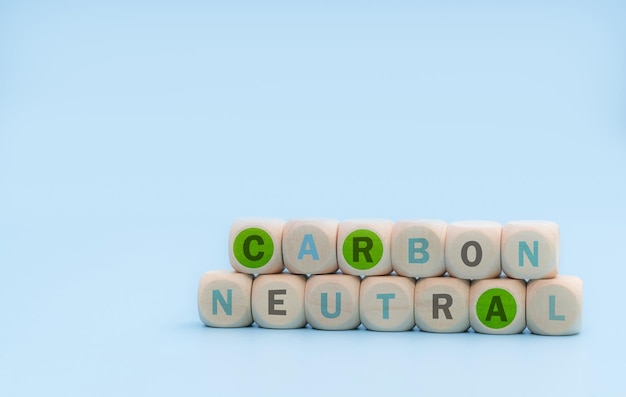 Carbon neutral concept Wooden cubes with carbon neutral words on blue background CO2 neutral