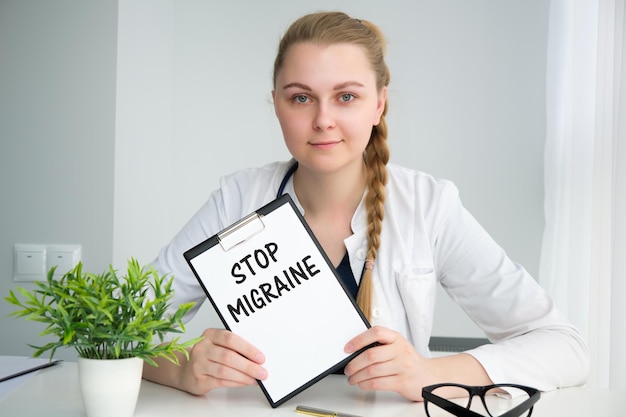 Card with text STOP MIGRAINE supplies pills and stethoscope