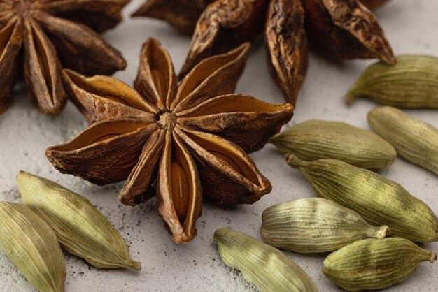 Photo cardamom and anise closeup on a porous background studio shot