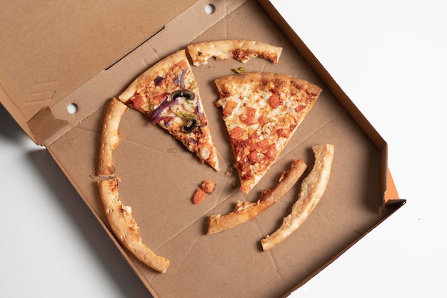 A cardboard box with unfinished pizza leftovers