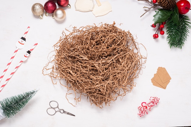 Cardboard box on wooden desk decorated with Christmas ornament