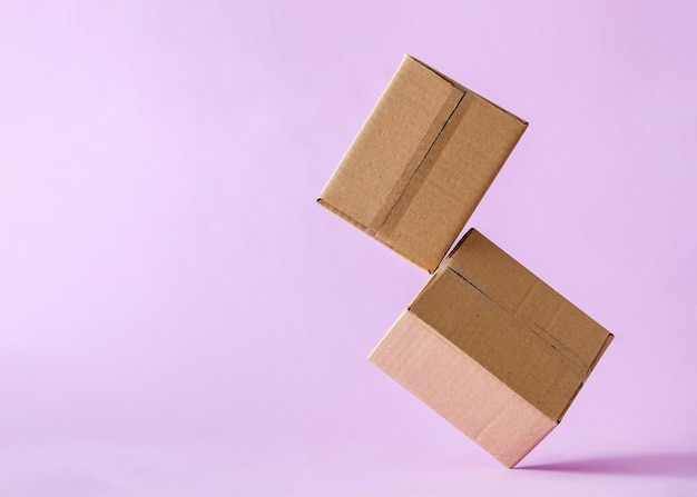 Cardboard boxes in levitation mail delivery and logistics concept