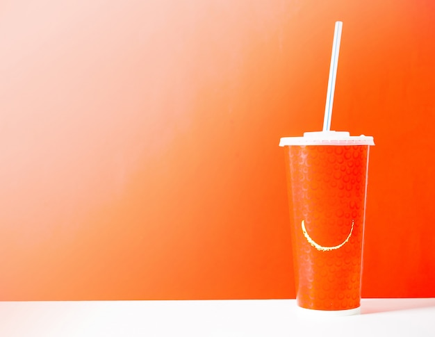 Photo cardboard cup with a straw