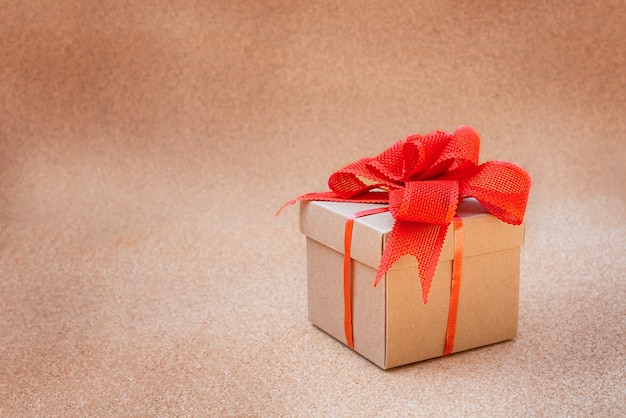 Cardboard gift box with red bow