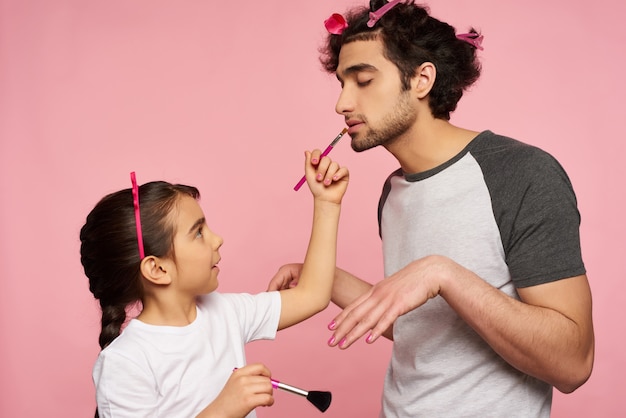 Care Arab Family. Little Girl Does Makeup To Father.