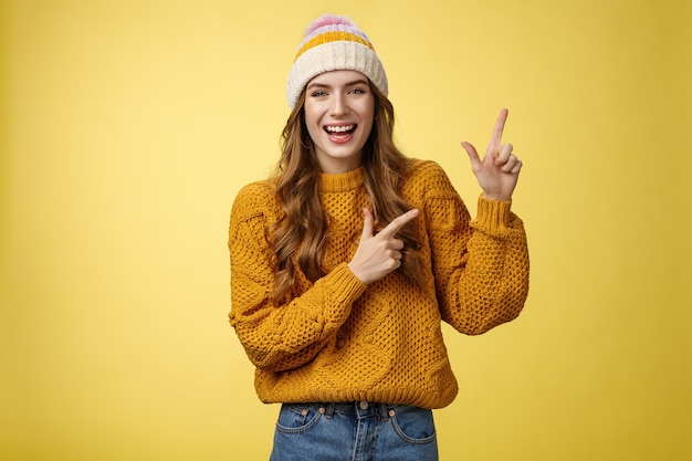 Carefree friendly nice flirty stylish woman wearing sweater hat laughing joyfully enjoying funny com...