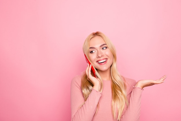 Carefree young girl talking on mobile