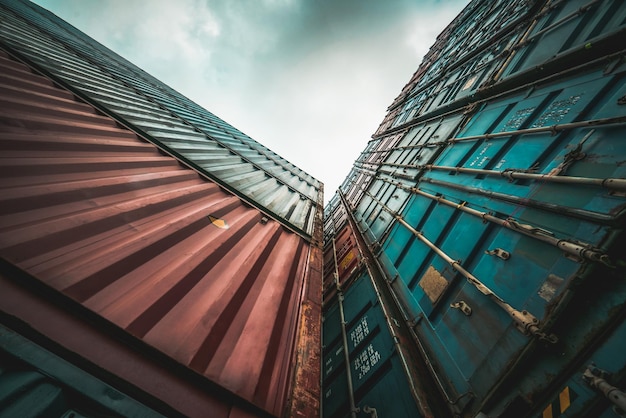 Cargo container for overseas shipping on high stack look up from ground