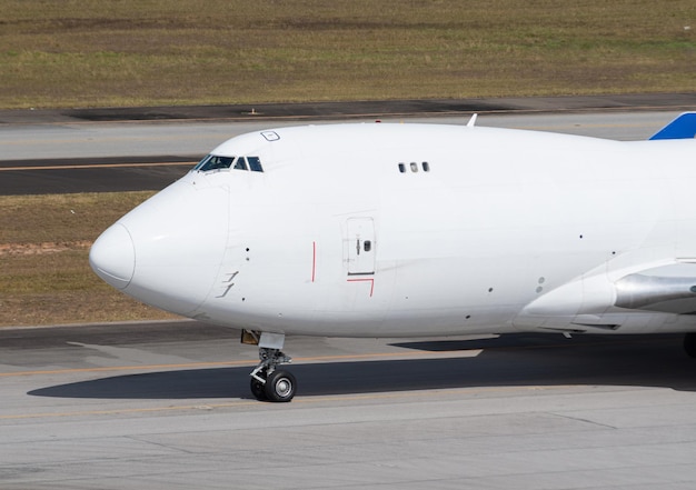 Cargo plane taxiing on runway for takeoff