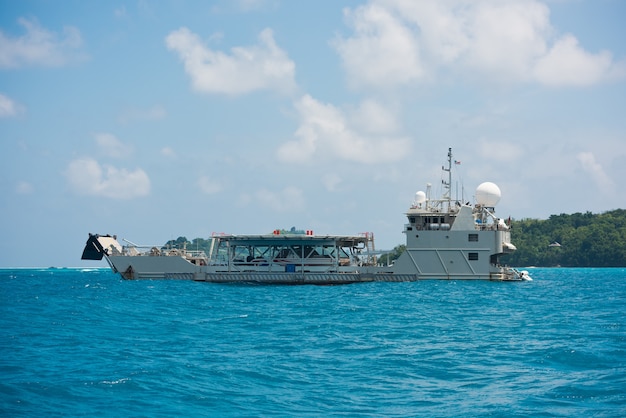 Cargo ship sailing in the Indian ocean near Seychelles islands