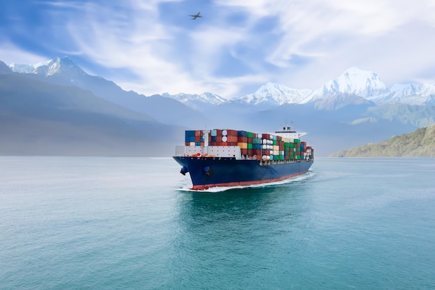 Cargo ship with containers in sea and mountain with airplane background Logistics transportation