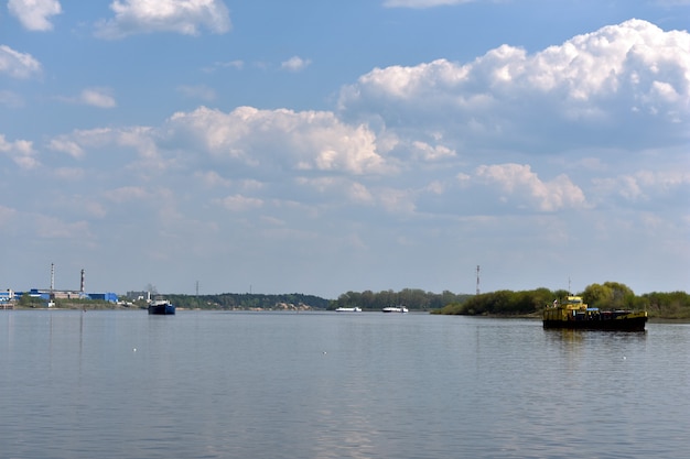 Cargo ships sail along the Volga River