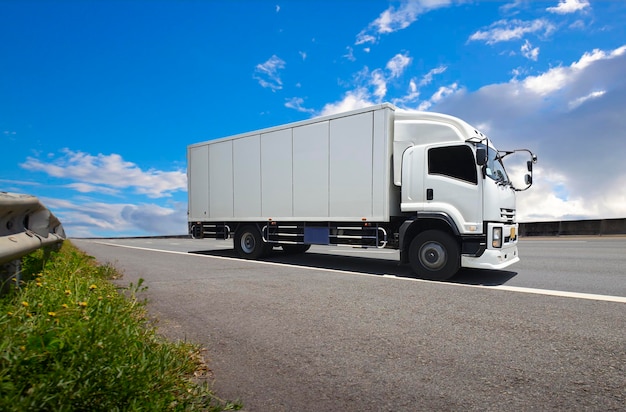 Cargo Truck Driving on the Road with a Blue Sky Industry Freight Truck Logistics Cargo Transport