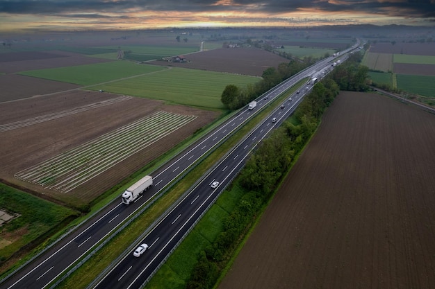 Cargo trucks and cars in the motorway high point of view