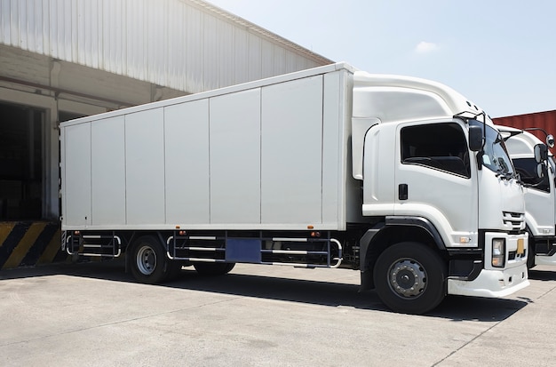 cargo trucks parked loading at dock warehouse freight truck transport shipping warehouse logistics