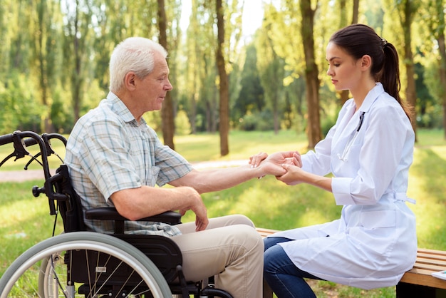 Caring for the elderly peoples in park.